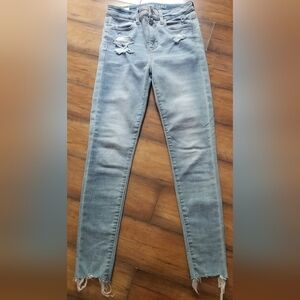 American Eagle Blue Skinny Jeans with Distressed Hem. Size 2